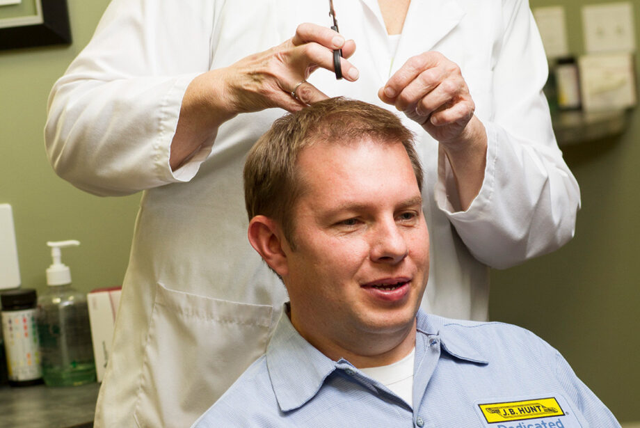 A driver for J.B. Hunt undergoes follicle sampling, which usually involves cutting or shaving an inch-and-a-half of hair.