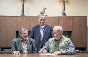 Today's Power President Michael Henderson, center, flanked by David Smith, CCEC's general manager, left, and CCEC Board President John Dalton.