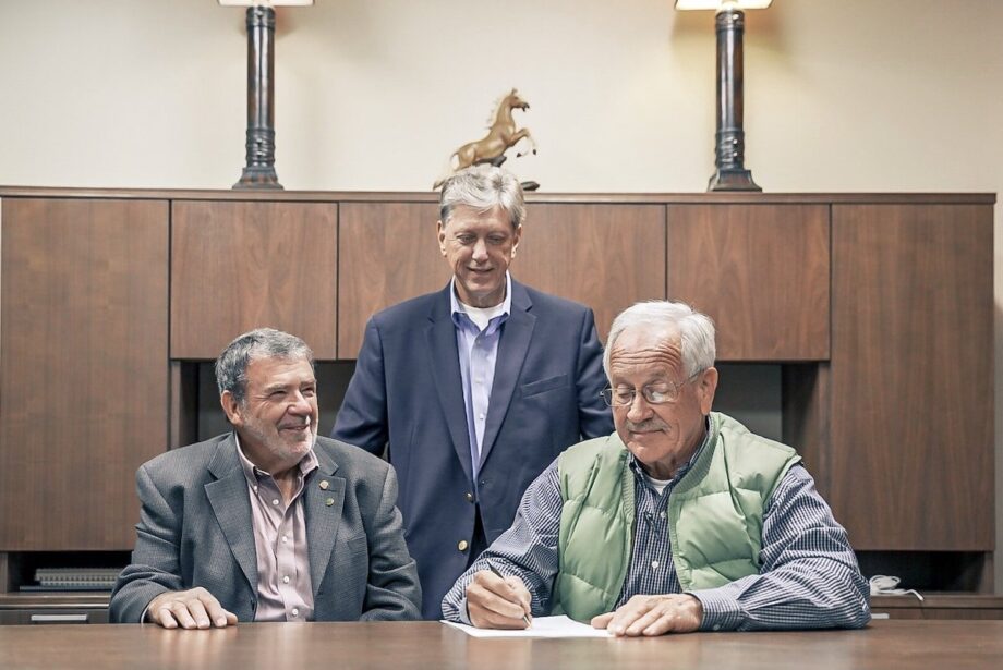 Today's Power President Michael Henderson, center, flanked by David Smith, CCEC's general manager, left, and CCEC Board President John Dalton.