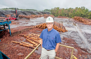 At Anthony Timberlands’  facility in Bearden, logs wait to be cut by a system that optimizes the amount of lumber that can be harvested from each log. Steve Anthony said he’s “conflicted” about the U.S.-China trade war.