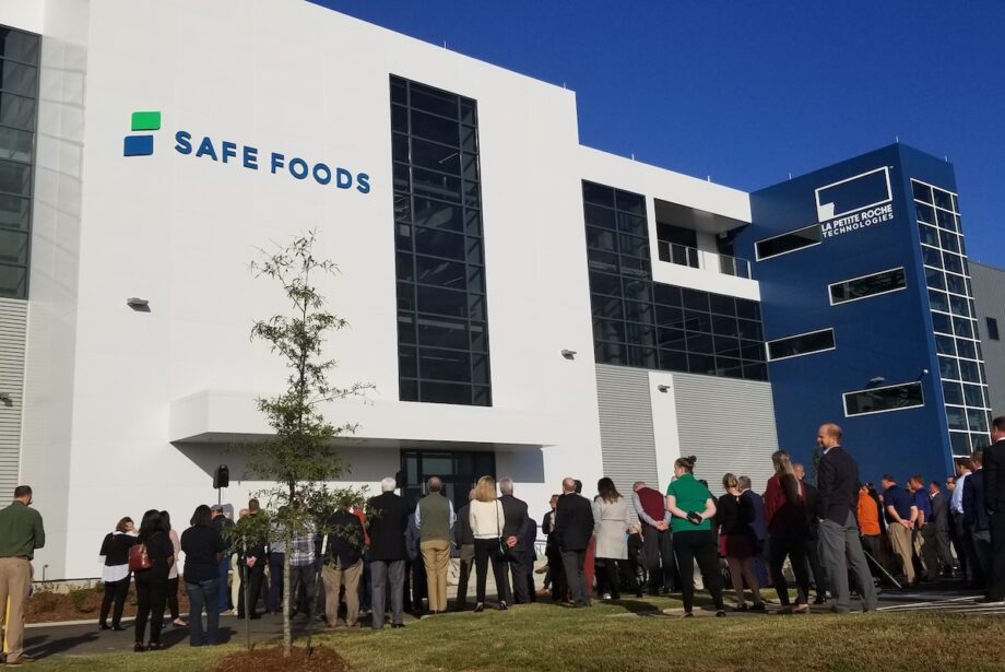 A crowd gathered Thursday to cut the ribbon for the grand opening of Safe Foods Corp.'s new headquarters in North Little Rock.