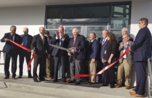 Safe Foods Corp. officials and local leaders cut the ribbon to celebrate the grand opening of the company's new headquarters in North Little Rock.