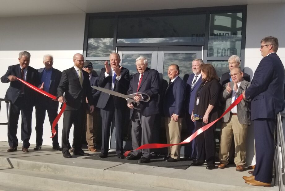 Safe Foods Corp. officials and local leaders cut the ribbon to celebrate the grand opening of the company's new headquarters in North Little Rock.