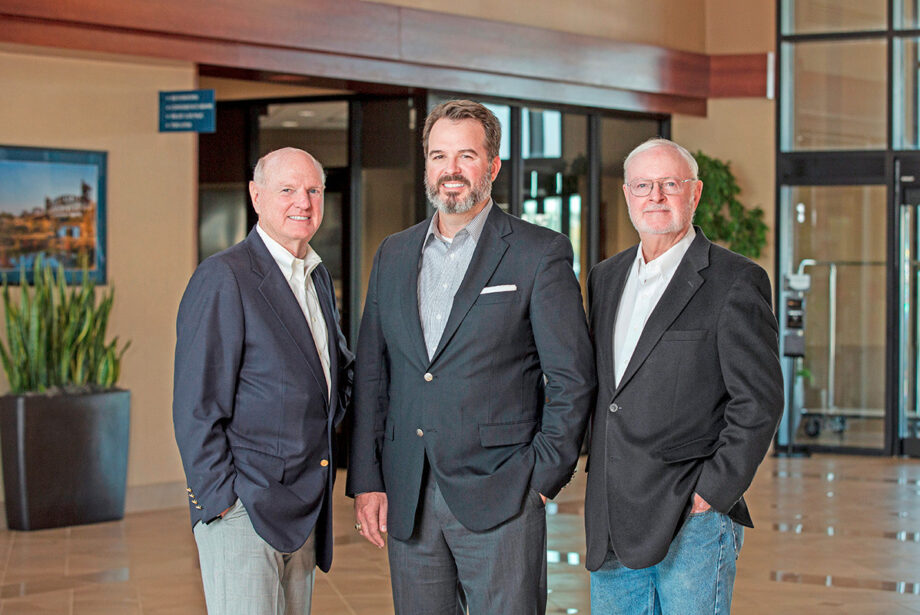 Van Tilbury, center, president and CEO of East Harding Construction, recently completed purchasing the company from Bob East, left, and Tom Harding.