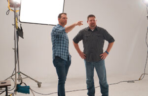 Michael Dunn, right, Bespoke’s creative director, listens to Nate Disarro, chief of video production, at the firm's Riverdale studios in 2017.