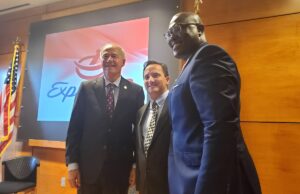 From left, Gov. Asa Hutchinson, Express Rx CEO&nbsp;Galen Perkins and Little Rock Mayor Frank Scott Jr. pose for a photo after announcing that the company has opened its new headquarters in the city.