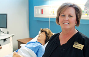 Carla Boyd, Northwest Arkansas Community College’s nursing program director, shows off the college’s new nursing simulation lab. NWACC is doubling its nursing enrollment.
