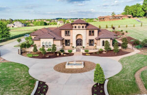 An 8,400-SF home in Fayetteville's Bridgewater Estates will stay in the Arkansas Razorbacks family for the time being.