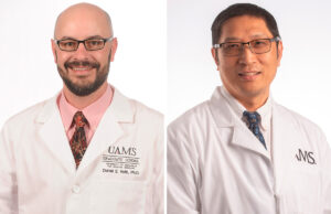 Daniel E. Voth and Dr. Fenghuang &ldquo;Frank&rdquo; Zhan of the University of Arkansas for Medical Sciences in Little Rock.