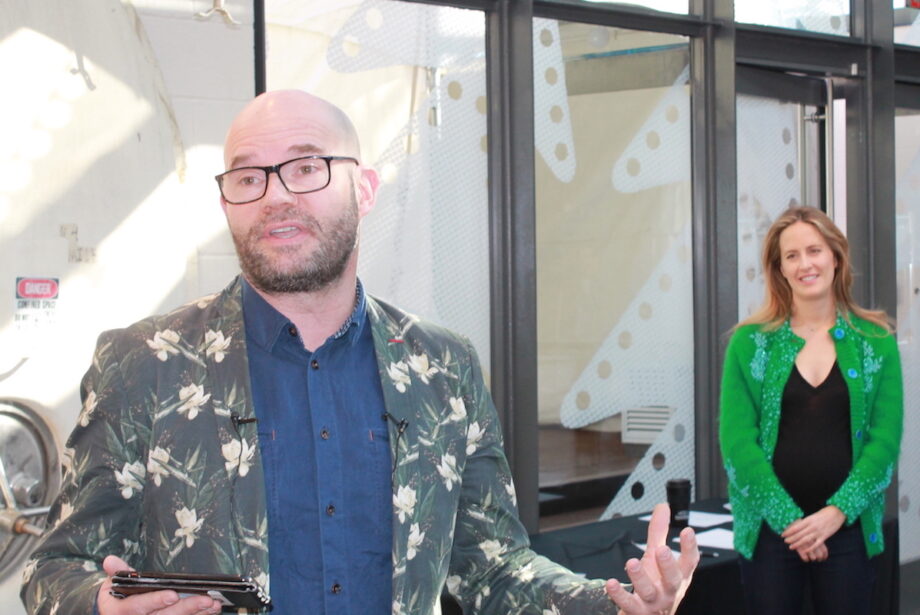 The Momentary Chairperson Olivia Walton looks on as Director Lieven Bertels makes remarks at the museum Friday.