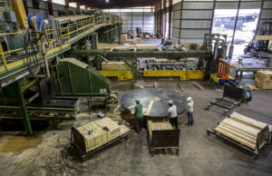 Workers sort scanned lumber into either two foot, four foot or six foot lengths at Anthony Timberlands in Bearden.