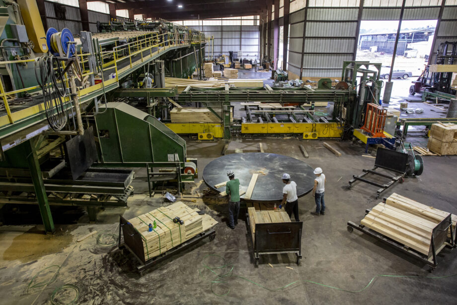 Workers sort scanned lumber into either two foot, four foot or six foot lengths at Anthony Timberlands in Bearden.