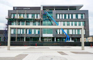 The First Orion Building, framed by a piece of Argenta Plaza, is a $15 million, 72,000-SF project including offices, a commercial gym and a Tusk & Trotter restaurant.