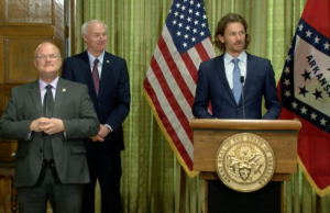 Steuart Walton, who is leading the governor's task force on reopening businesses, speaks at a Wednesday news conference.