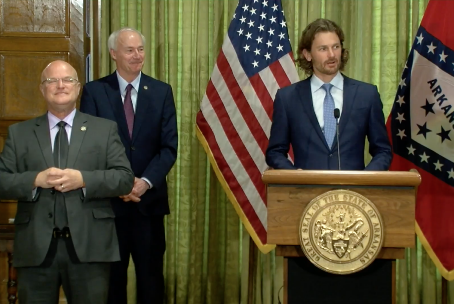 Steuart Walton, who is leading the governor's task force on reopening businesses, speaks at a Wednesday news conference.