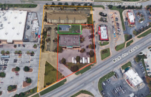 Golden Hospitality LLC, the owner of the Candlewood Suites shown above, owns the parcels outlined in yellow. SCE Properties LLC plans to build a Kum & Go store on its land, outlined in red. While the area outlined in green is within SCE's parcels, Golden Hospitality is asking for the area to be designated a prescriptive easement. (Parcel lines are approximate.)