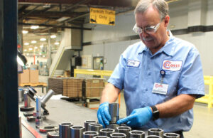Skilled hands conduct a quality inspection at Cloyes Gear & Products which is based in Fort Smith and has a 155,000-SF manufacturing plant in Paris (Logan County).