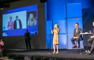 40 Under 40 honoree Alisha Curtis takes the stage, greeted by supporters via live video.