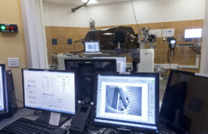 Krakow, Poland, circa May 2016. Proton therapy of eyeball cancer, Bronowice Cyclotron Center, Institute of Nuclear Physics. A patient positioning chair in a treatment room and computer softwere.