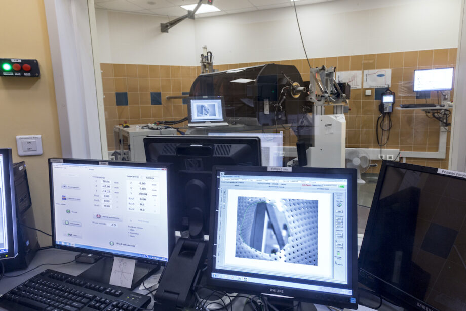 Krakow, Poland, circa May 2016. Proton therapy of eyeball cancer, Bronowice Cyclotron Center, Institute of Nuclear Physics. A patient positioning chair in a treatment room and computer softwere.