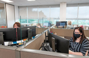 Transparent cubicle wall extensions are among the coronavirus-inspired alterations to work spaces like this one at the business office of the Arkansas Department of Transformation and Shared Services in the Winthrop Rockefeller Building at 501 Woodlane St.