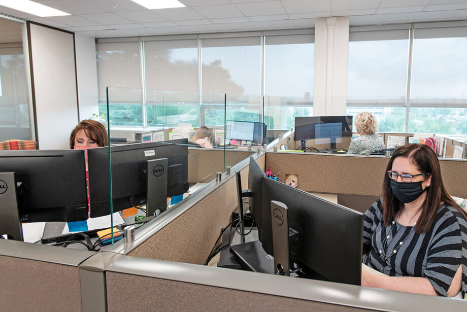 Transparent cubicle wall extensions are among the coronavirus-inspired alterations to work spaces like this one at the business office of the Arkansas Department of Transformation and Shared Services in the Winthrop Rockefeller Building at 501 Woodlane St.