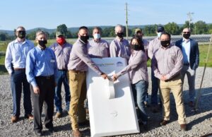 City officials and Today&rsquo;s Power Inc. staff&nbsp;flip a symbolic solar switch Thursday&nbsp;on a 1.5-megawatt municipal solar array in Paris, Arkansas.