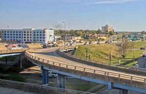 The Arkansas State Highway Commission is seeking about 8,300 SF of land from the property on which a new Holiday Inn Express, the blue building on the left, is being built.