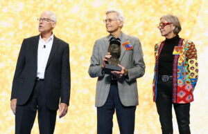 Rob Walton, Jim Walton and Alice Walton present the Entrepreneur of the Year award at the 2019 Walmart shareholders meeting in Fayetteville.
