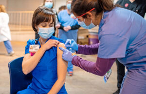Deborah Hutts of the University of Arkansas for Medical Sciences receiving a vaccination recently to protect her from COVID-19.