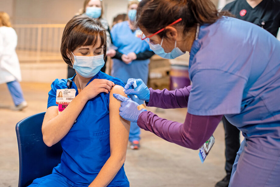 Deborah Hutts of the University of Arkansas for Medical Sciences receiving a vaccination recently to protect her from COVID-19.