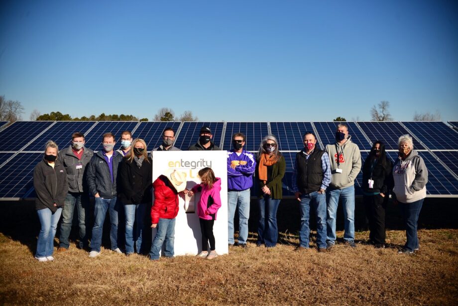 Officials with Concord Public Schools and Entegrity&nbsp;flip the switch on Jan. 22 for a new 341-kilowatt sun array built by Entegrity of Little Rock.