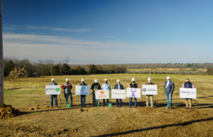 The cities of Springdale and Lincoln, along with Elkins and Lincoln Public Schools and OzarksGo, were represented Friday at a solar array construction site near Lincoln (Washington County).