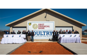 Trey Berry, president of Southern Arkansas University, donors, Board of Trustee members and administrators conclude a ribbon-cutting ceremony for the&nbsp;First Financial Bank Poultry Education Facility with an &ldquo;egg cracking."