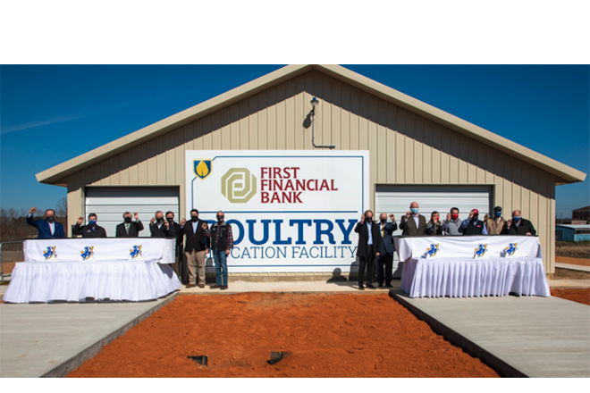 Trey Berry, president of Southern Arkansas University, donors, Board of Trustee members and administrators conclude a ribbon-cutting ceremony for the&nbsp;First Financial Bank Poultry Education Facility with an &ldquo;egg cracking."