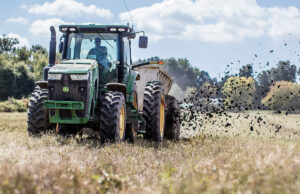A Denali Water Solutions employee in Chattanooga, Tennessee, spreads waste residuals converted to a type of fertilizer for beneficial use on a farm field.