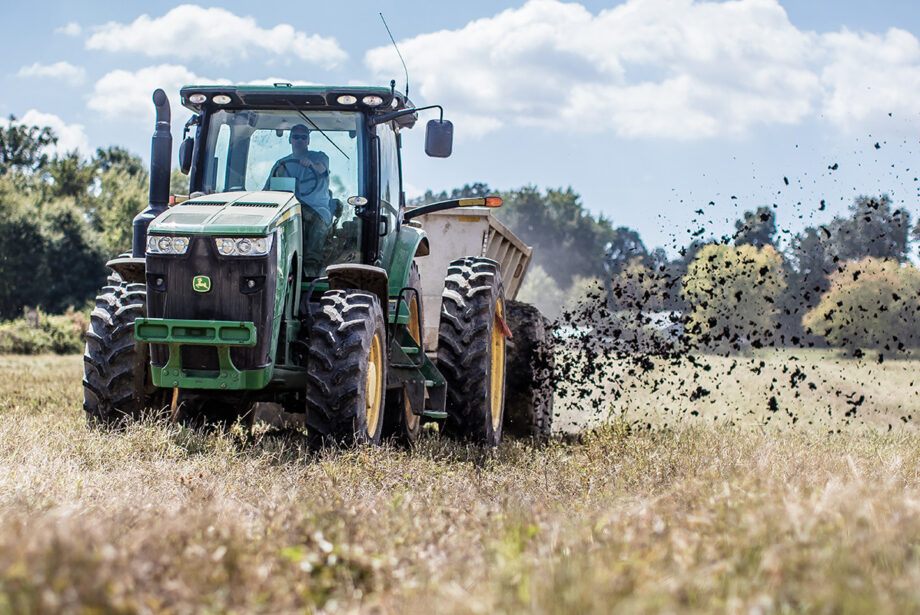 A Denali Water Solutions employee in Chattanooga, Tennessee, spreads waste residuals converted to a type of fertilizer for beneficial use on a farm field.