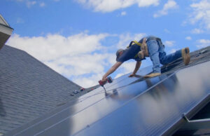 A solar installer at a job financed via Loanpal, which finances sustainable home projects. It opened a planned 100-worker operation last month in Bentonville.