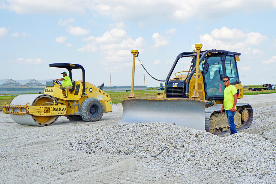 Workers with Hawkeye Enterprises doing paving work near Newport’s airport, known locally as the air base. The area is home to a dozen industries and two state prisons.