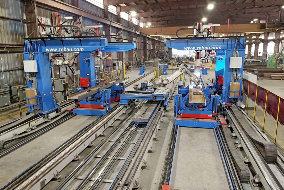 Prospect Steel in Blytheville, a Lexicon company, has “the most automated fit and weld fabrication facility in the world,” CEO Patrick Schueck says. Its double robotic line, seen here, consists of four welding robots and one fitting robot.