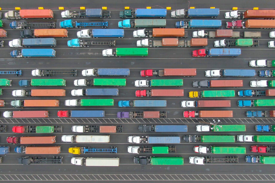 Loaded cargo trucks wait in queues at the Port of Los Angeles.