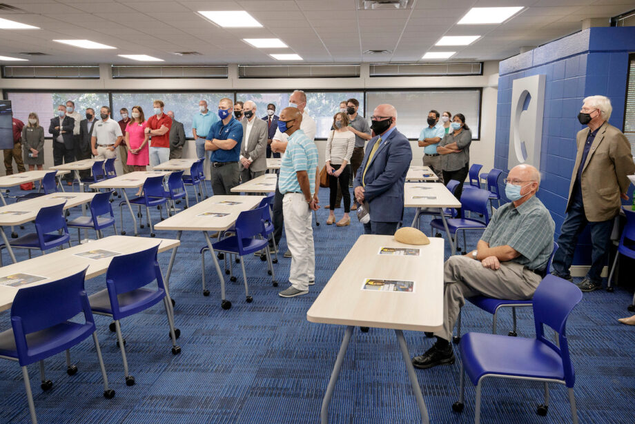 A crowd gathers for the opening and dedication cermony for the Clark Project Management Lab at the University of Arkansas at Little Rock.&nbsp;