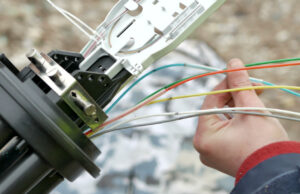A technician installs fiber optic cables. Little River County, Arkansas has received a $2 million federal grant to build fiber optic cable lines to support broadband infrastructure.&nbsp;