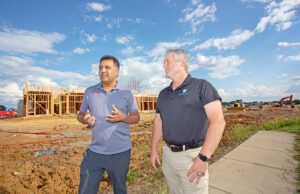 Dr. James Thomas, owner-developer of the Maly District, left, and Eric Holloway, owner of  Maumelle’s Holloway Engineering, talk about the rollout of construction at the Conway project.
