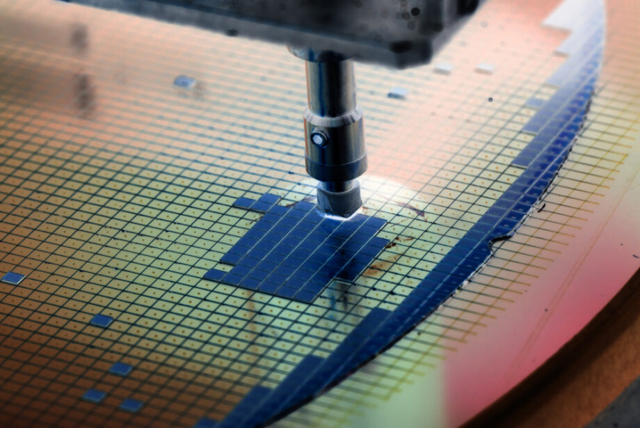 A silicon wafer being placed on a semiconductor device by a die attach machine.&nbsp;