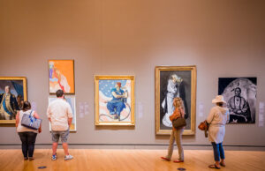 Visitors to the museum view some of its iconic works, including Norman Rockwell’s “Rosie the Riveter.”