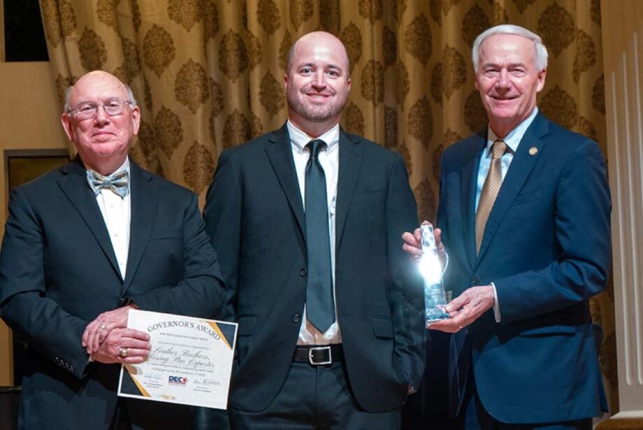 Michael Schrekenhofer (middle) of Leather Brothers Inc. accepts a&nbsp;Governor's Award for Excellence in Global Trade from&nbsp;Rudy Ortiz, chair of the Arkansas District Export Council (left) and Gov. Asa Hutchinson.
