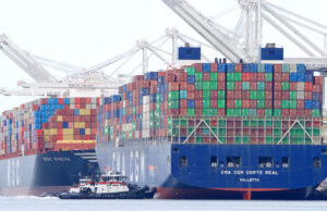 Multiple tugboats assisting a container ship to maneuver sideways to the dock at the Port of Oakland, the fifth busiest port in the U.S., in March 2021.&nbsp;
