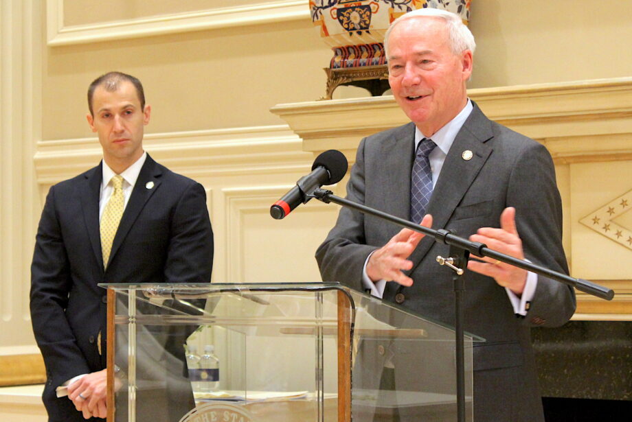 Gov. Asa Hutchinson (right) and Commerce Secretary Mike Preston speak to reporters on Wednesday at the governor's mansion about U.S. Steel's plans for a $3 billion steel mill in Osceola.