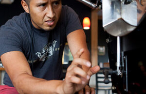 Geovanni Leiva, co-founder of Leiva's Coffee, roasts a batch of coffee beans.